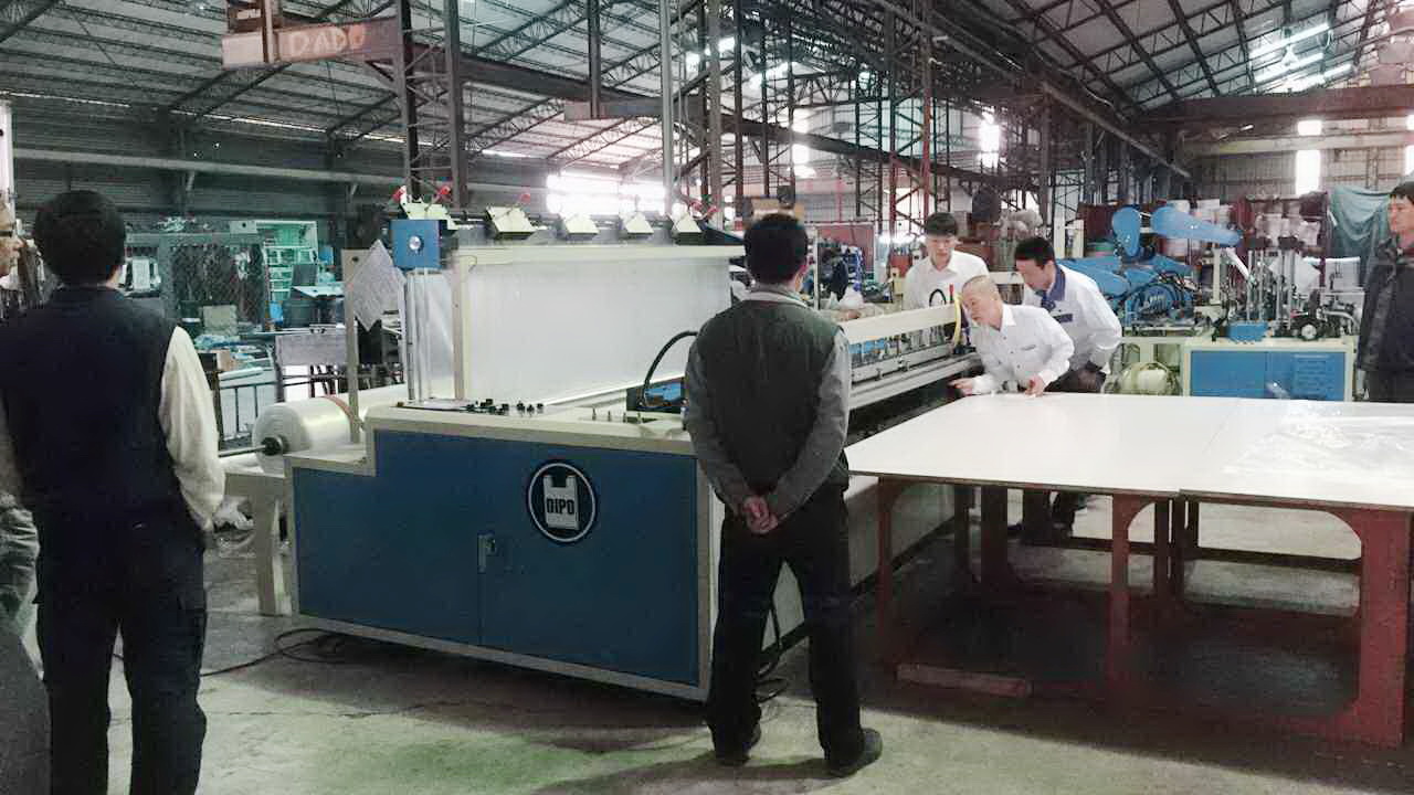 Japanese customers come to our company to inspect our bag making machines.